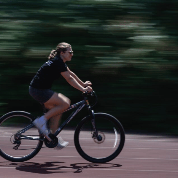 Adult riding a regular bike around the cycle centre circuit