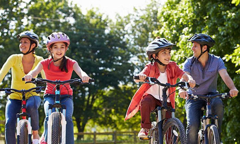 Young children riding a bike