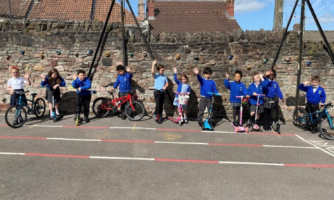 Children riding a bike at Summerhill Infant School Bristol