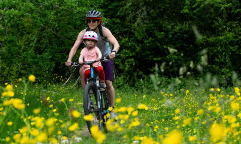 Women and daughter mountain biking