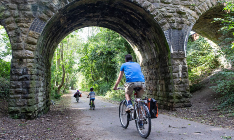 Family cycling along Bristol to Bath Cycle Path