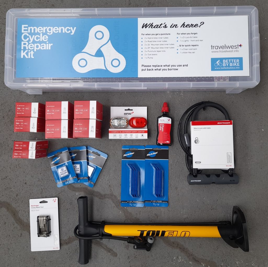 Photo of contents of emergency repair kit box - including pump, puncture repair kits etc