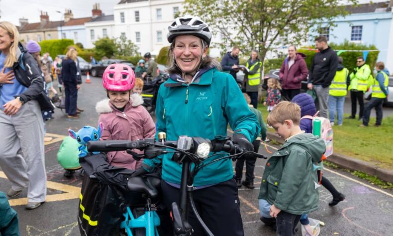 Mother and daughter cycling to school