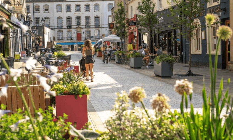 Sunny day with people walking along Princess Victoria Street in Bristol